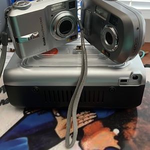 I’m selling both cameras with docking station for printing